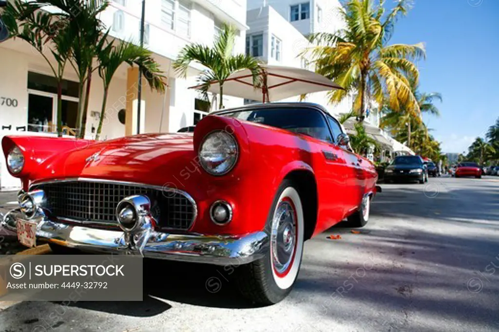 Sports car on Ocean Drive in the sunlight, Miami Beach, Florida, USA