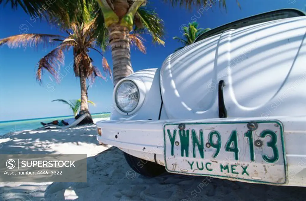 White VW Beetle parked on a beach, Boca Paila, Quintana Roo, Yucatan, Mexico