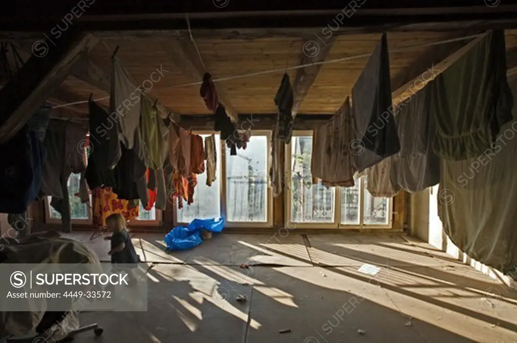 roof attic with washing line, old house in Berlin