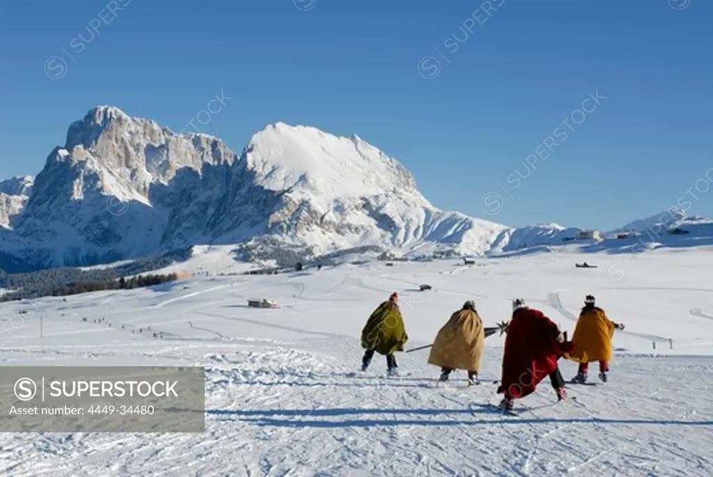 Star boys on ski under blue sky, Alpe di Siusi, Valle Isarco, Italy, Europe