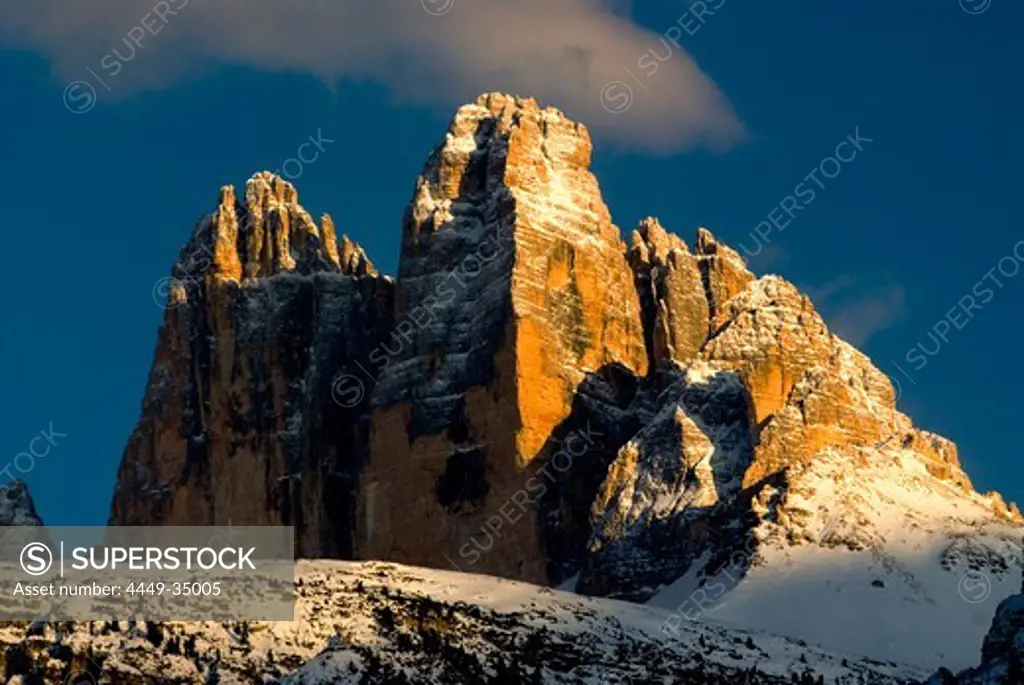 Snow covered mountain top in front of blue sky, Sexten Dolomites, South Tyrol, Italy, Europe