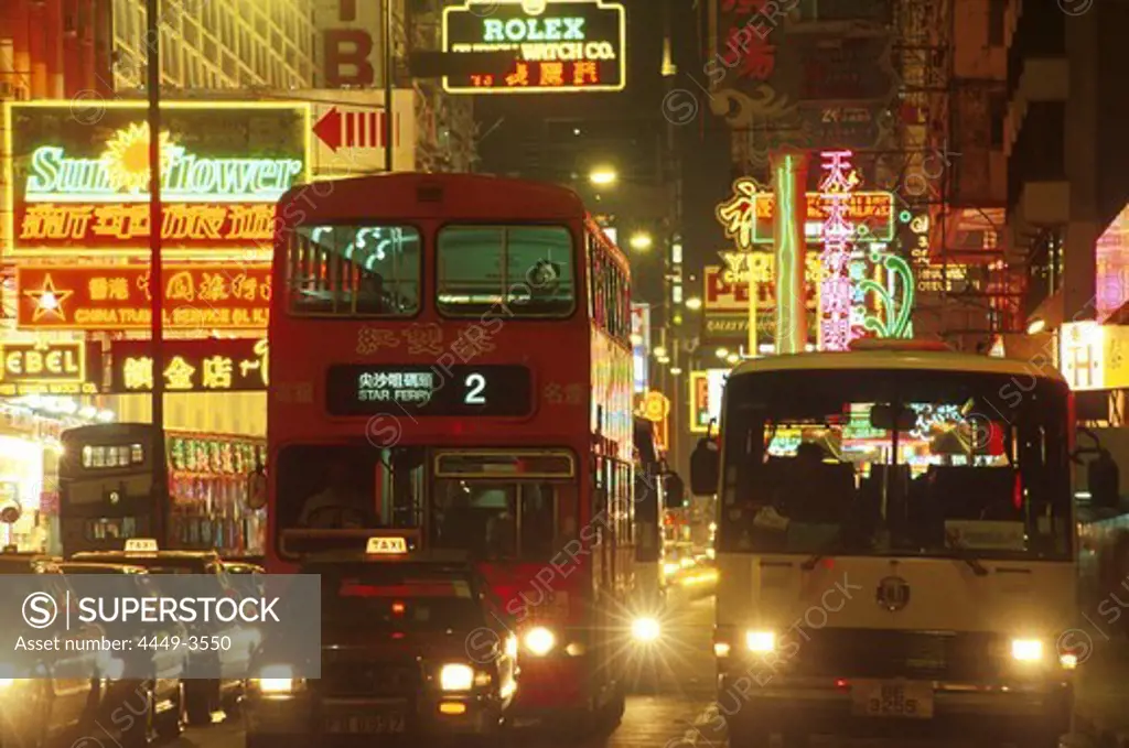 Neon signs and cars at Nathan Road at night, Hong Kong, China, Asia