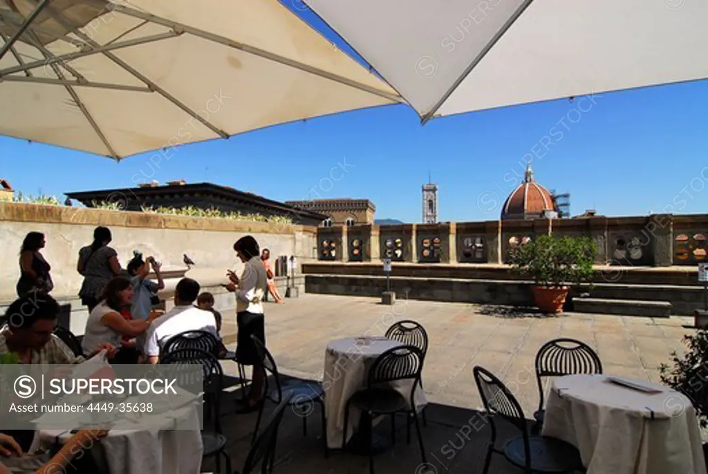People sitting on the roof terrace of the Uffizi gallery under sunshades, Florence, Tuscany, Italy, Europe