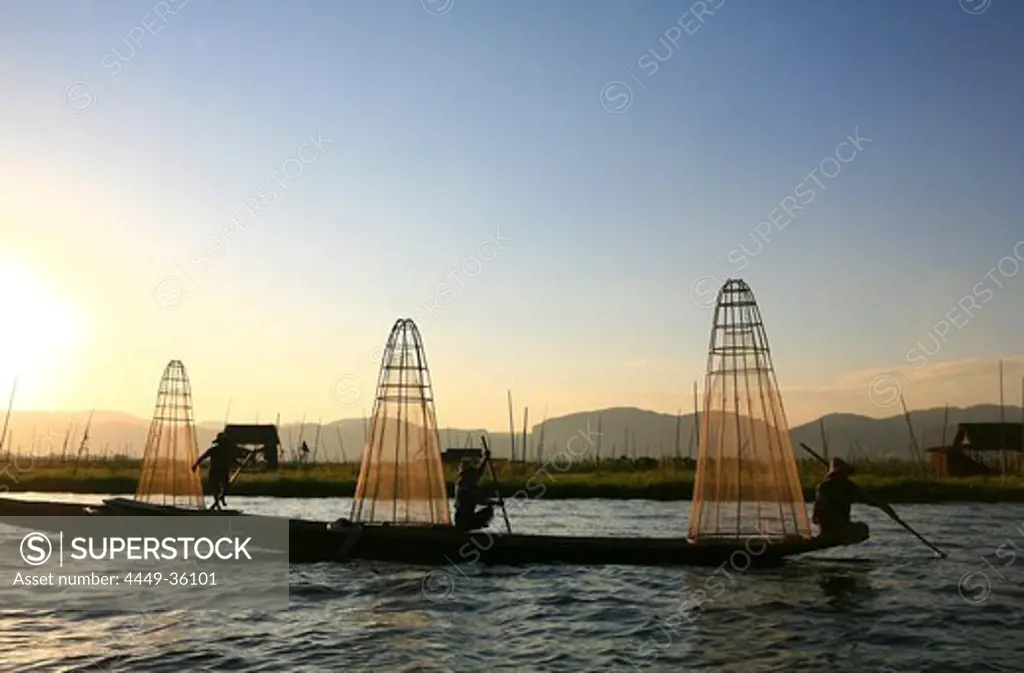 Intha fishermen with fish traps in the evening light, Inle Lake, Shan State, Myanmar, Burma, Asia