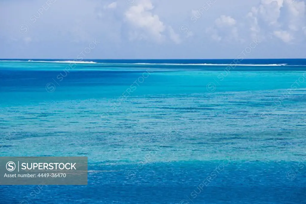 Water of dazzling turquoise and reef at Huahine lagoon, Huahine, Society Islands, French Polynesia, South Pacific, Oceania