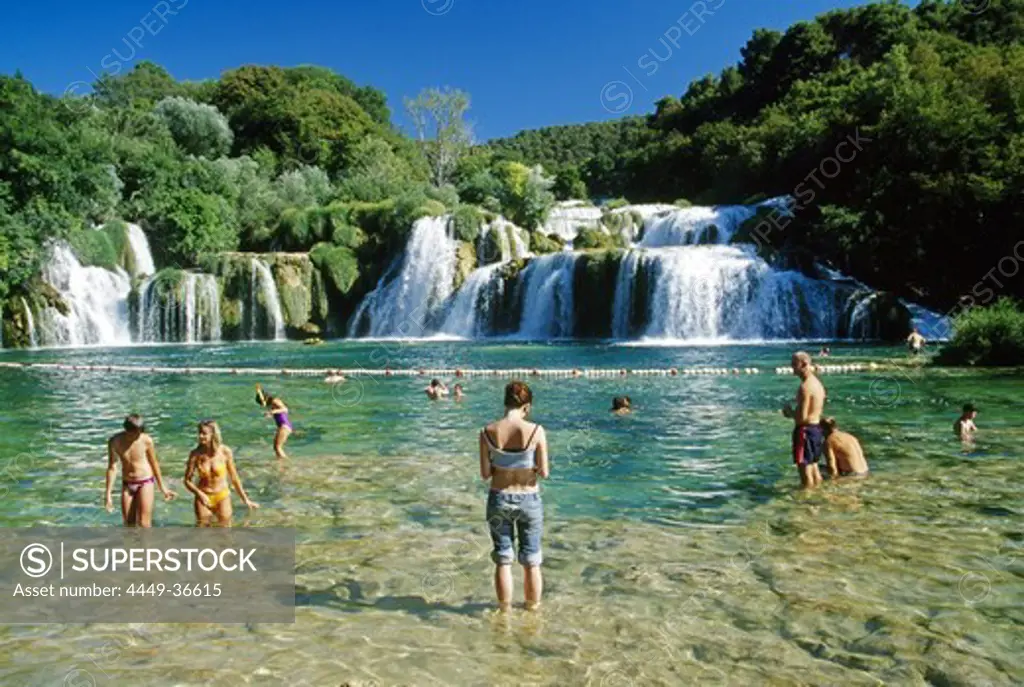 People bathing at Krka waterfalls, Krka National Park, Croatian Adriatic Sea, Dalmatia, Croatia, Europe