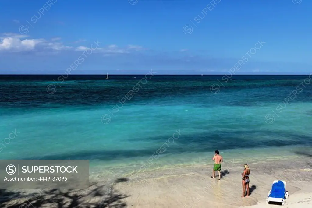 View over sandy beach to horizon over Atlantic Ocean, Guardalavaca, Holguin, Cuba, West Indies