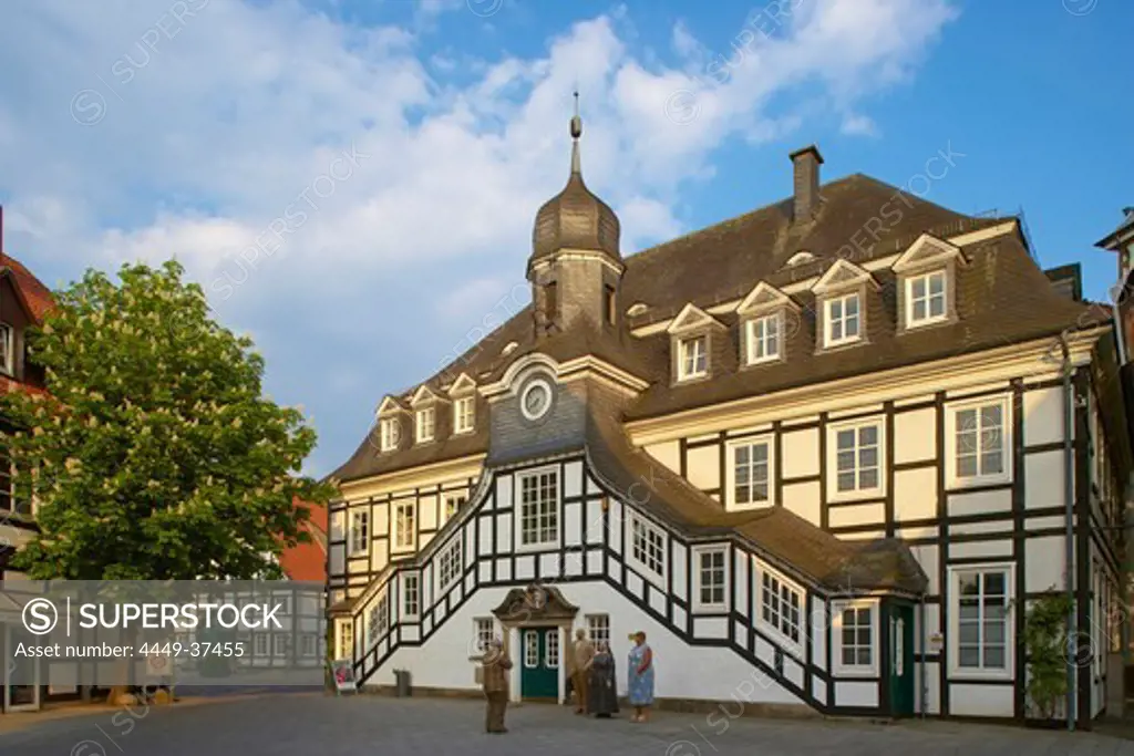 Town hall (half-timbered house from 1804) and sculpture called Augenblicke by Christel Lechner, Rietberg, Kreis Guetersloh, Teutoburger Wald, Northrhine-Westphalia, Germany, Europe
