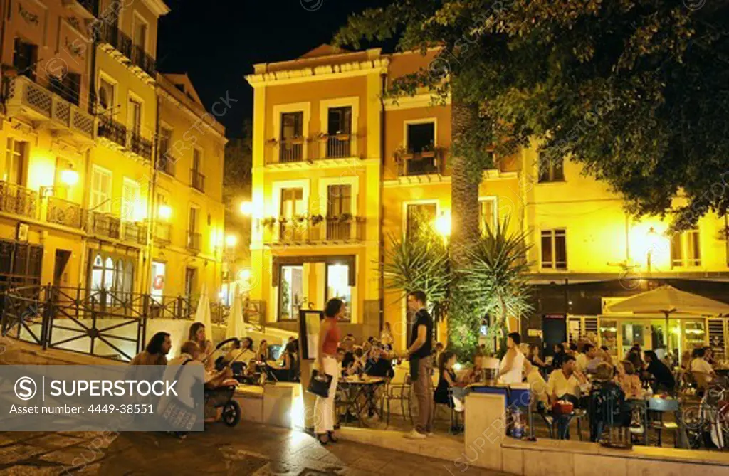 People sitting at restaurants at the Marinaquarter in the evening, Cagliari, Sardinia, Italy, Europe