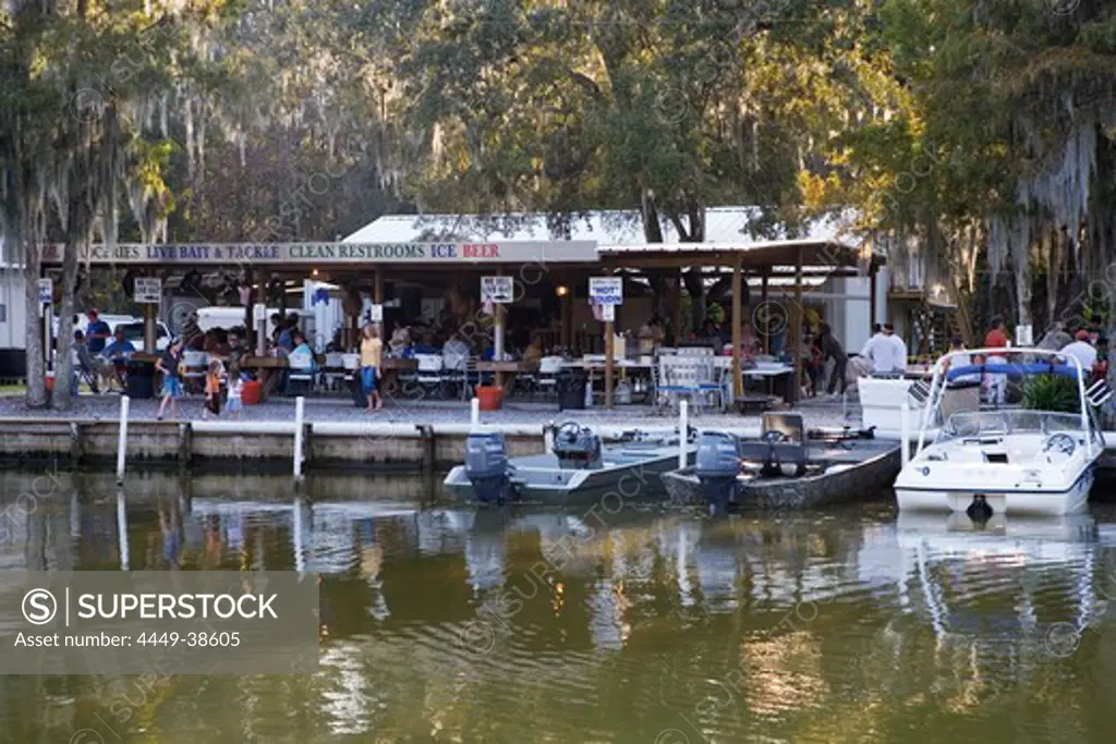 Barbecue party with Cajun live music at a gas station for boats near Attakapas Landing on Lake Verret, near Pierre Part, Louisiana, USA