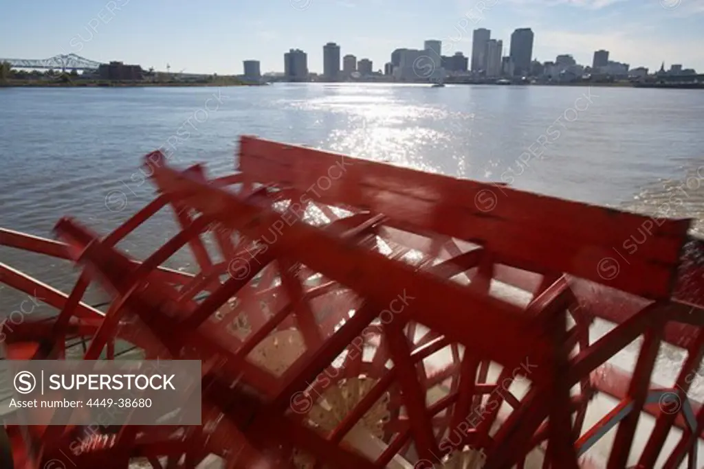 Paddles of a paddle wheeler on the Mississippi, with downtown New Orleans in the background, Louisiana, USA