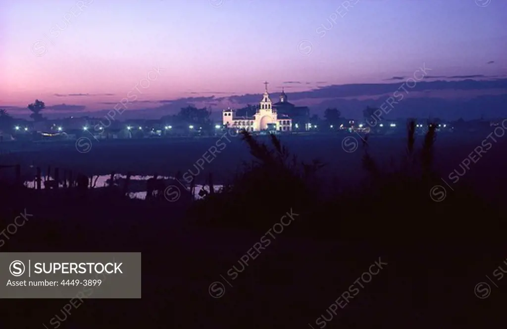Illuminated pilgrimage church in the evening, El Rocío, Andalusia, Spain, Europe