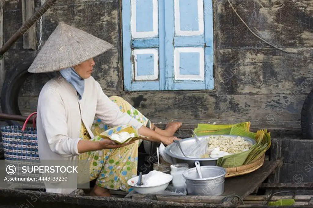 Floating Market, woman in a boat on the Mekong River at Tra On, Mekong Delta, Can Tho Province, Vietnam, Asia
