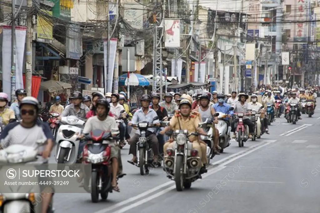 Street setting, moped riders on a street at Saigon, Hoh Chi Minh City, Vietnam, Asia