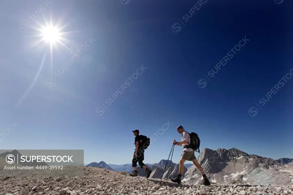 Two hikers on Zugspitzplatt, Wetterstein range, Bavaria, Germany