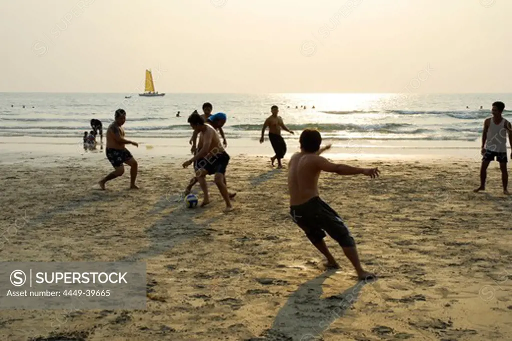 Men playing football, soccer on the beach, White Sand Beach, Hat Had Sai Khao, Koh Chang Island, National Park Mu Ko Chang, Trat, Gulf of Thailand, Thailand, Asia