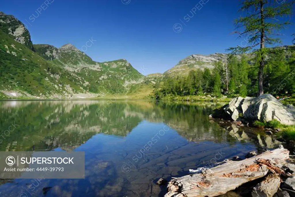 Mountain lake Lago Alzasca with reflection, Ticino range, Ticino, Switzerland