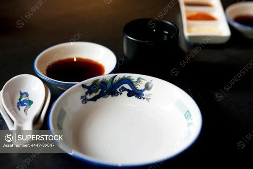 Table with bowl and soy sauce in Dim Sum restaurant Red Dragon, Hong Kong, China