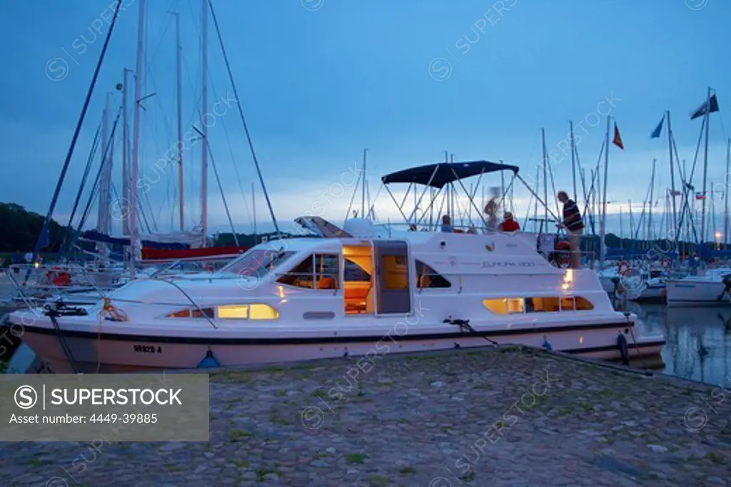Evening at Stynort (Steinort) Marina, Houseboat and sailing boats on Lake Dargin (Jezioro Dargin), Mazurskie Pojezierze, East Prussia, Poland, Europe