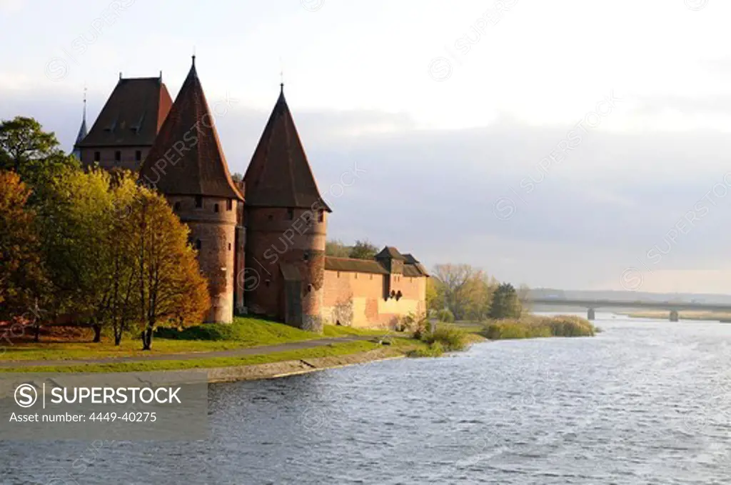 City wall of Malbourg at the banks of a river, north-Poland, Poland, Europe
