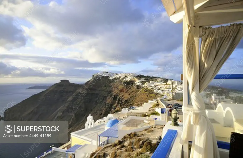 View from a balcony at houses and coast, Firostefani, island of Santorin, the Cyclades, Greece, Europe