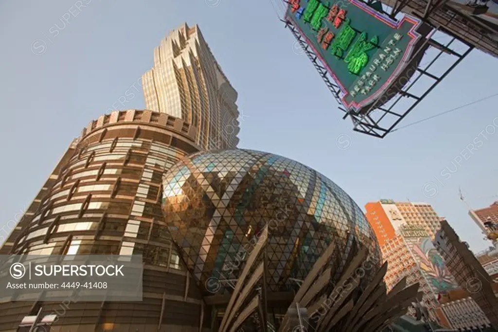 Facade of the Casino Hotel Grand Lisboa and neon sign of a pawnbroker, Macao, China, Asia