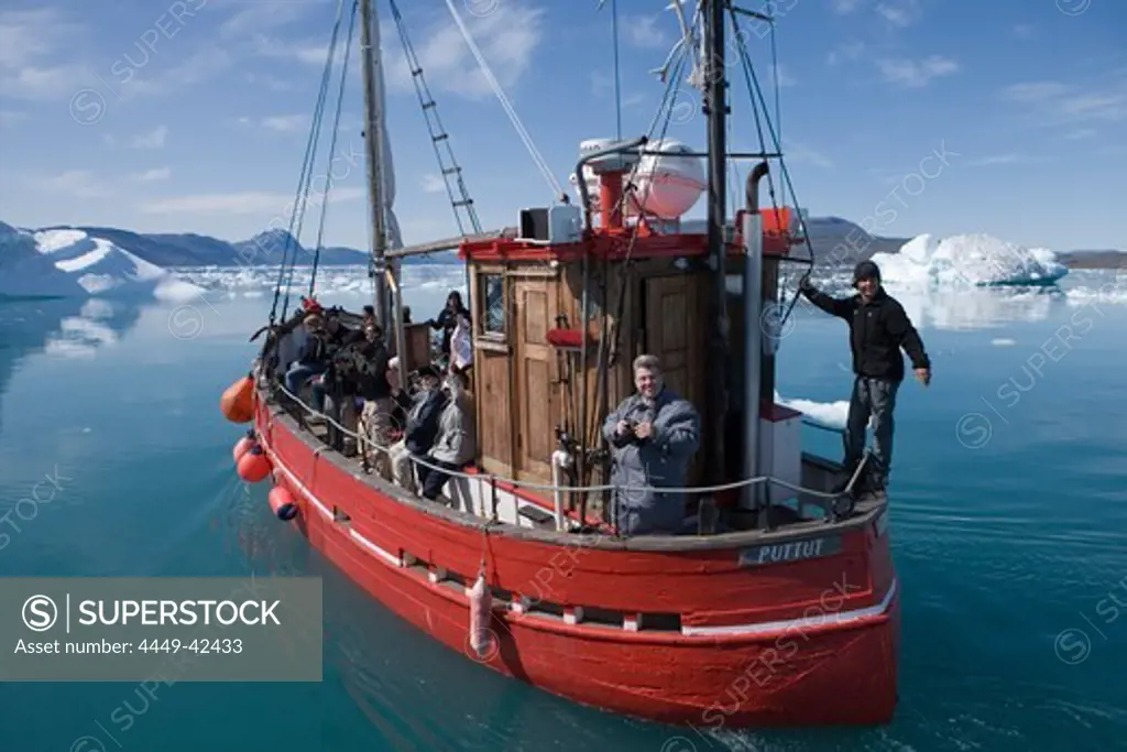 Fishing boat on sightseeing tour in front of icebergs at Qooroq Fjord, Narsarsuaq, Kitaa, Greenland