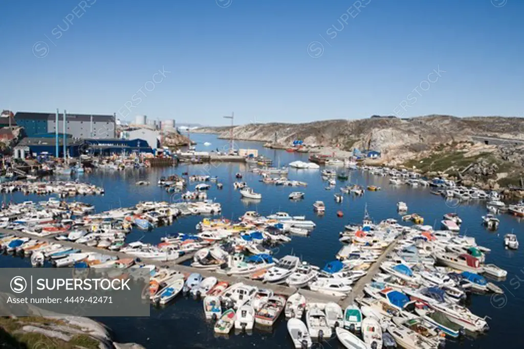 Fishing boats at harbour and Royal Greenland Seafood Processing Plant, Ilulissat (Jakobshavn), Disko Bay, Kitaa, Greenland