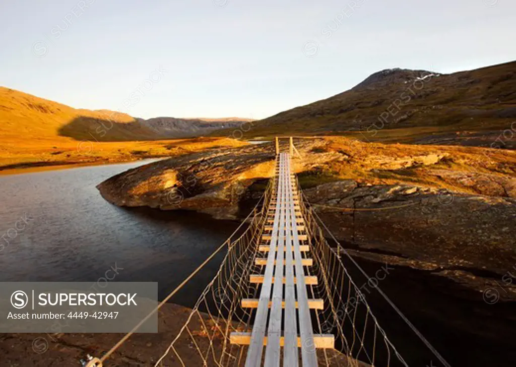 Suspension bridge in the Storengdalen in autumn, Sjurfjellet Saltar, Norway, Scandinavia, Europe