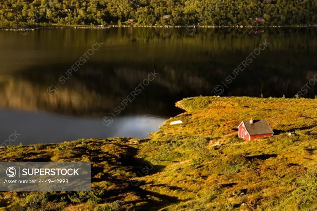 Red wooden house at lake Mannsvatnet at the Solfjellet, Folgefonn peninsula, Kvinnherad, Norway, Scandinavia, Europe