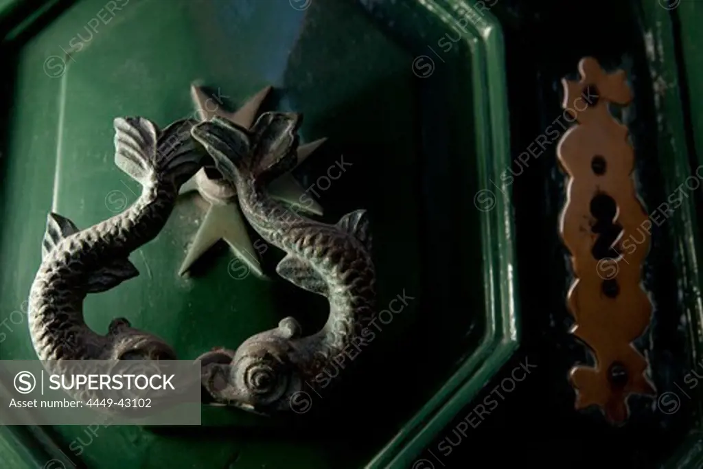 Close-up of a door knocker, dolphins and the Maltese Cross are signs of the knights of Malta, Valletta, Malta, Europe