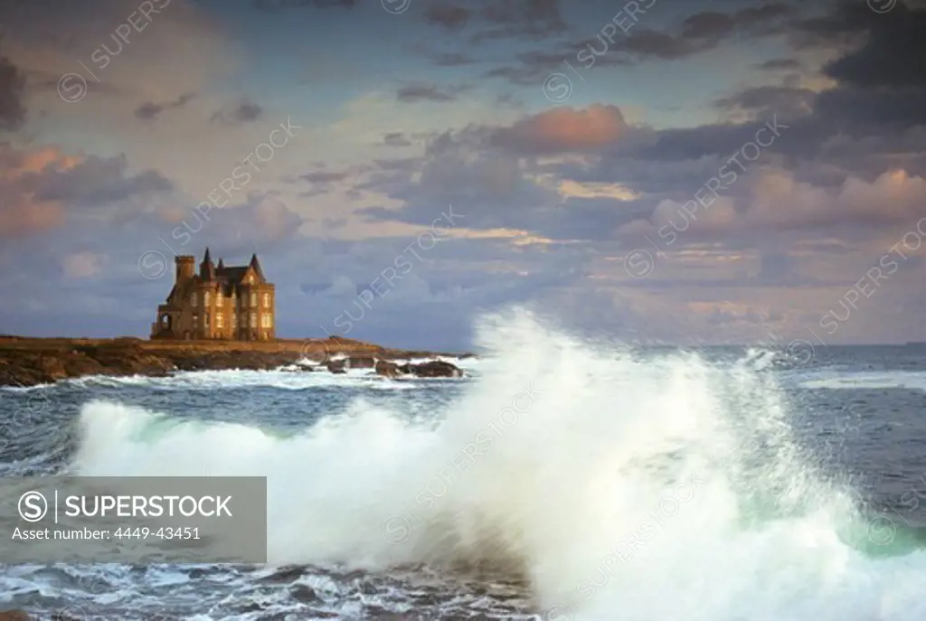 The surge and Chateau Turpeau in the light of the evening sun, Cote Sauvage, Quiberon, Brittany, France, Europe