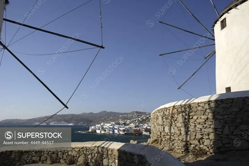 Windmills at the coast in the sunlight, Mykonos, Greece, Europe