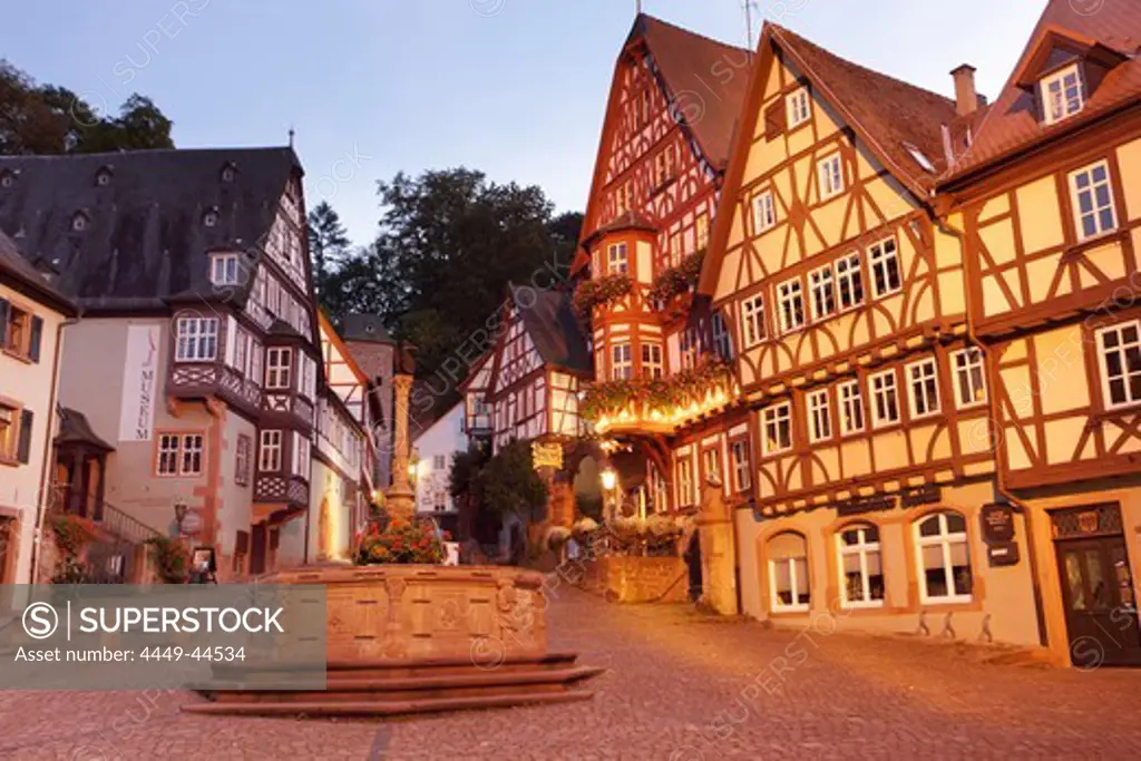 The market square with the fountain and the ensemble of half-timbered houses in the evening, Miltenberg am Main, Franconia, Bavaria, Germany, Europe
