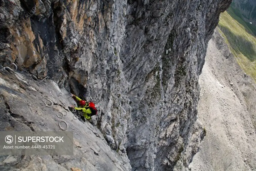 Woman climbing, Senda Ferrata verticala, Piz Mitgel, Savognin, Grisons, Switzerland