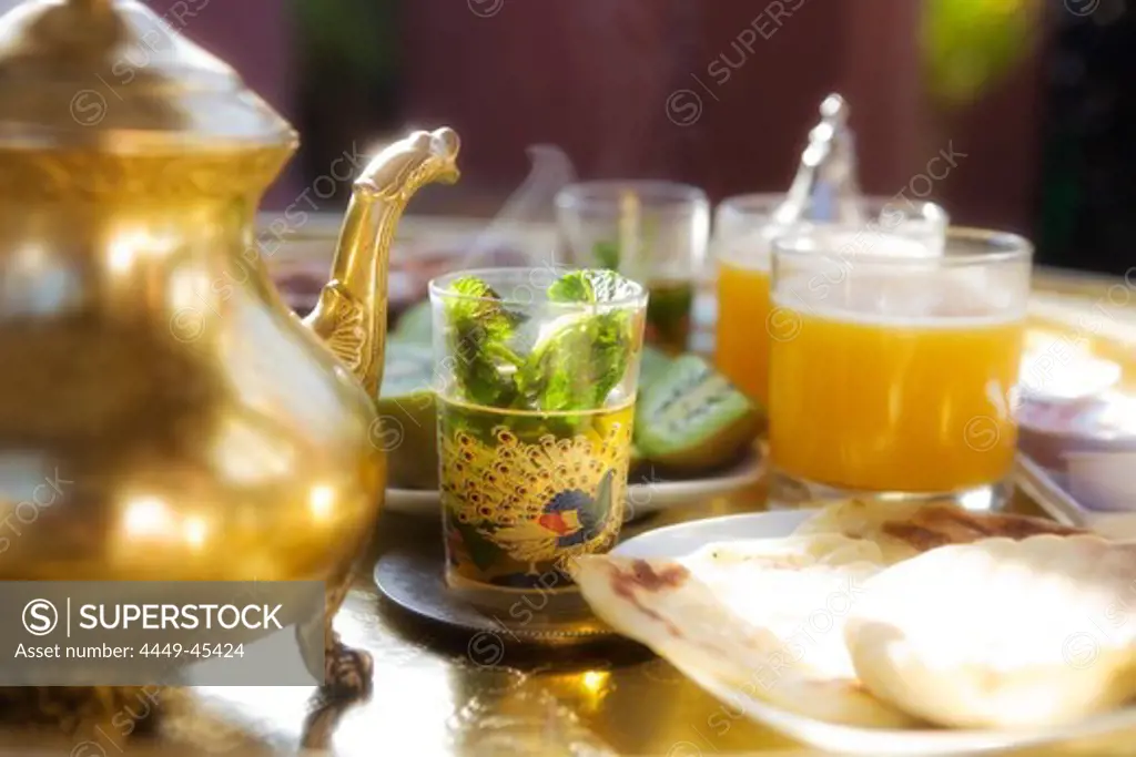 Moroccan breakfast with peppermint tea, Kiwi and orange juice, Riad Kaiss, Marrakech, Morocco, Africa