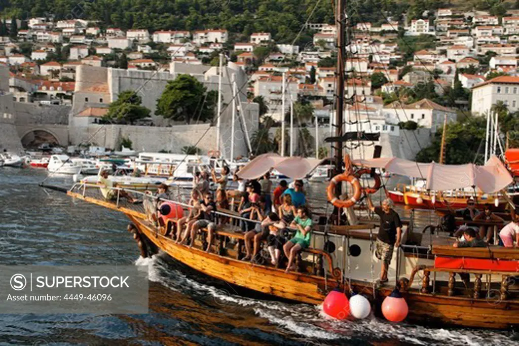 Tourist excursion ship entering old port of Dubrovnik harbour, Croatia, Europe
