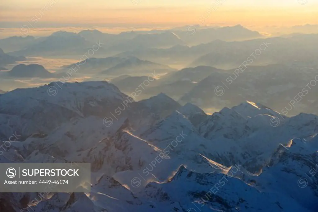 Aerial view towards Karwendel range, Kitzbuehel range and Berchtesgaden range at sunrise, Tyrol, Austria, Europe