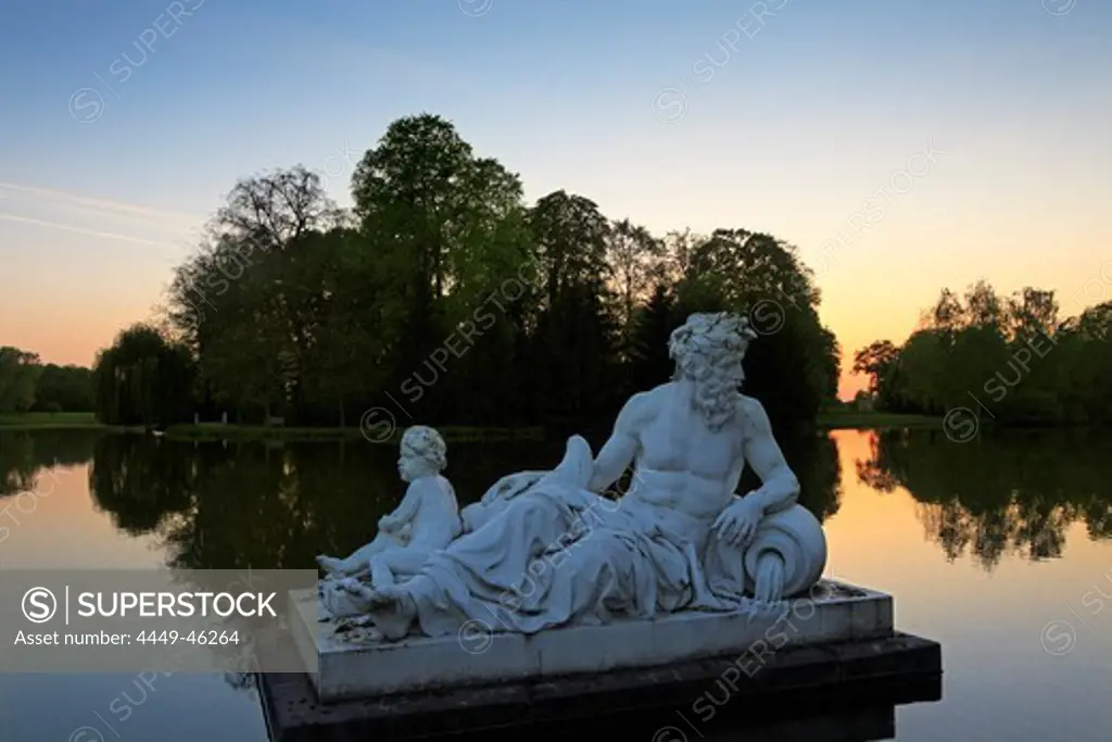 Sculptures at the lake in the palace garden, Schwetzingen, Baden-Wuerttemberg, Germany