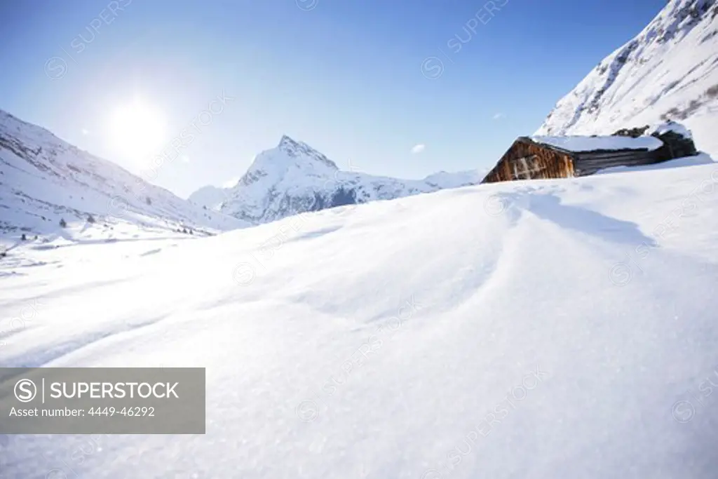 Snow-covered barn, Ballun peak in background, Galtuer, Paznaun valley, Tyrol, Austria