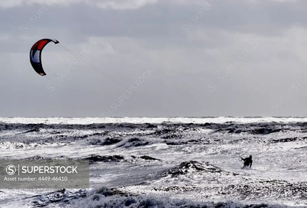 Person kite surfing, North Sea Beach in Westerland, Sylt, Schleswig-Holstein, Germany