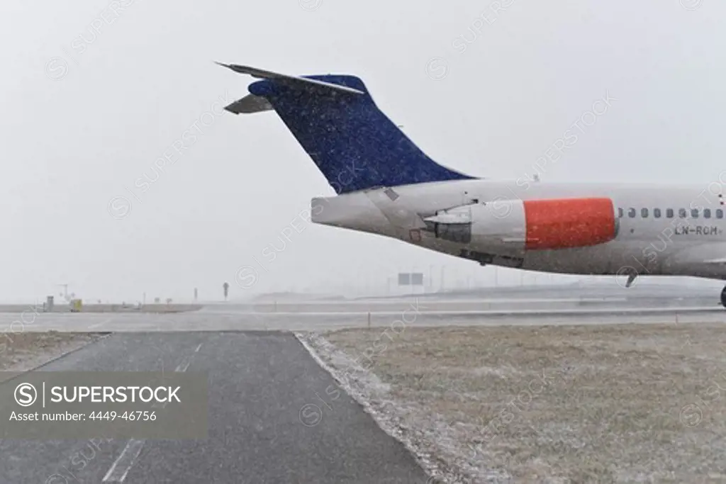 Airport taxiway in snowfall, Munich airport, Bavaria, Germany