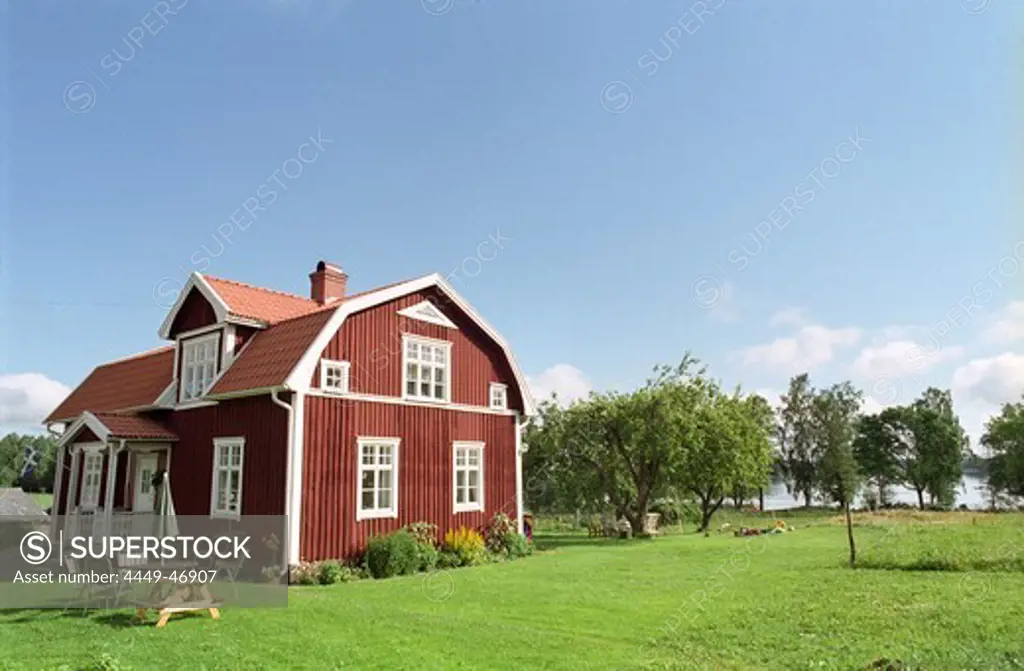 Countryside with red wooden cottage, Smaland, Sweden, Europe