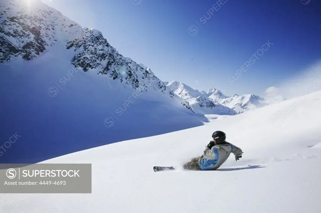 Person snowboarding in fresh snow, Gaiskogel, Kuehtai, Tyrol, Austria