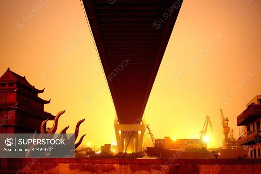 Low angle view at Nanpu bridge at sunset, Shanghai, China, Asia