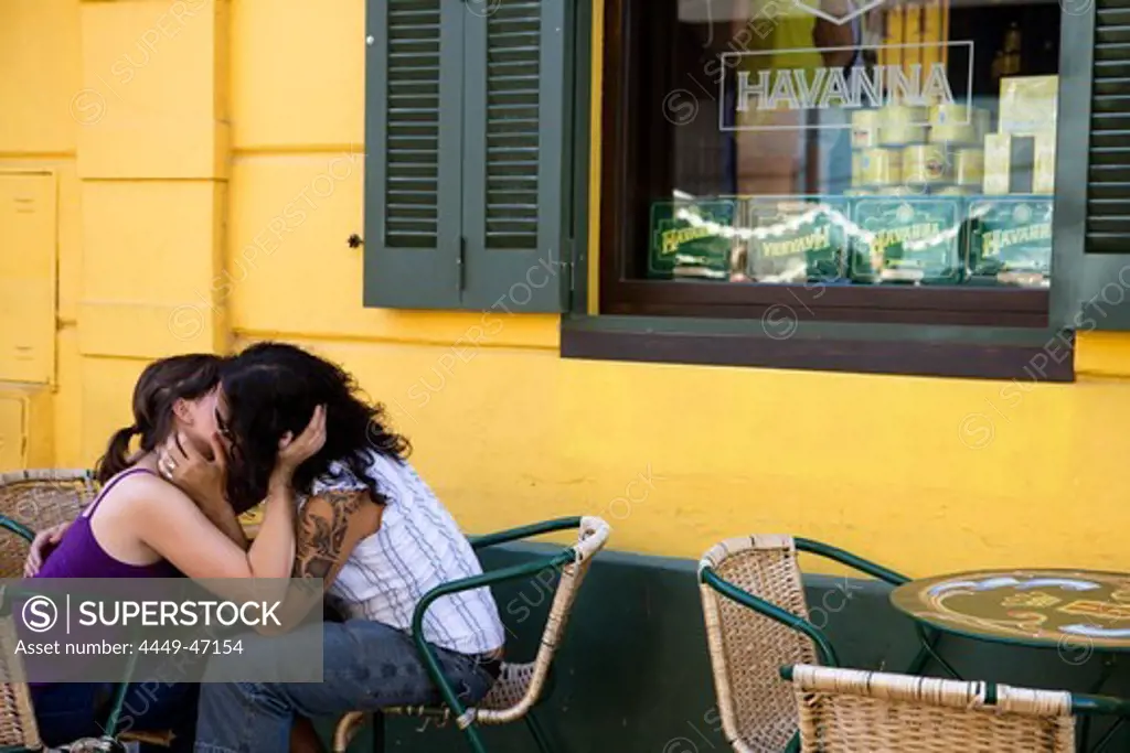 Smooching couple outside Havanna Bar in La Boca district, Buenos Aires, Argentina, South America, America