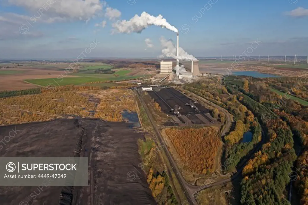 Aerial view of a lignite open-pit mine at fossil-fuel power station Buschhaus, cooling towers in the background, Helmstedt, Lower Saxony, northern Germany