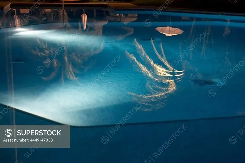 Swimmingpool at night at Las Dunas Hotel, Estepona, Malaga, Spain
