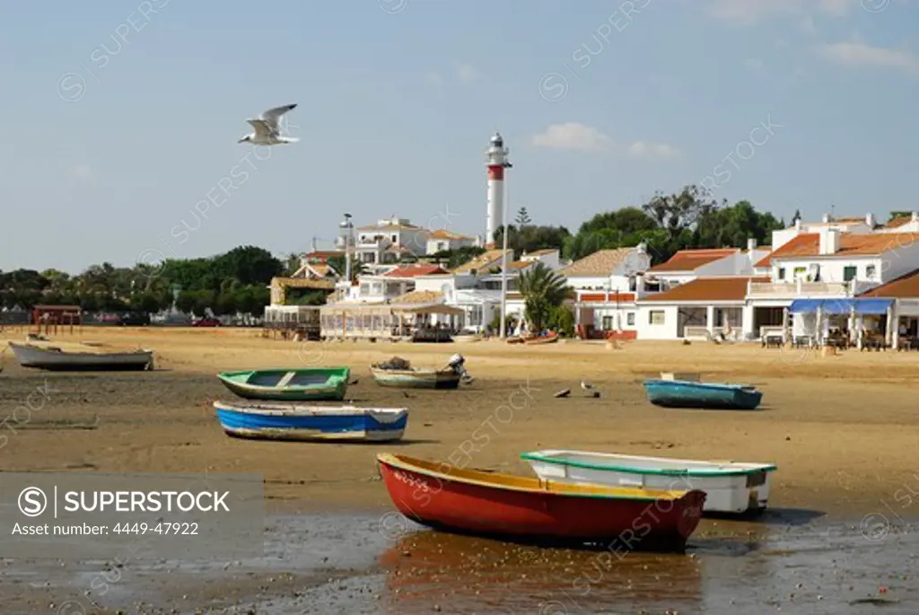 Boats at the Rio Piedras river, ebb tide at the beach in El Rompido, Cartaya, Costa de la Luz, Huelva, Andalusia, Andalucia, Spain, Europe