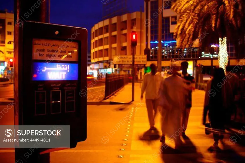 Arabs crossing at street at night, Dubai, UAE, United Arab Emirates, Middle East, Asia